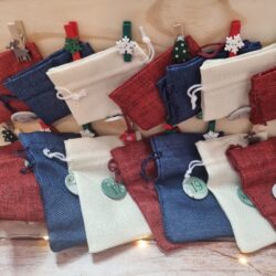 Wooden advent calendar with fabric pouches