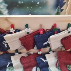 Wooden advent calendar with fabric pouches