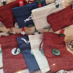 Wooden advent calendar with fabric pouches