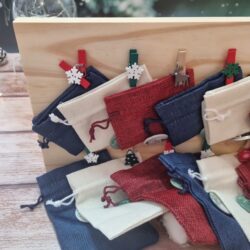 Wooden advent calendar with fabric pouches